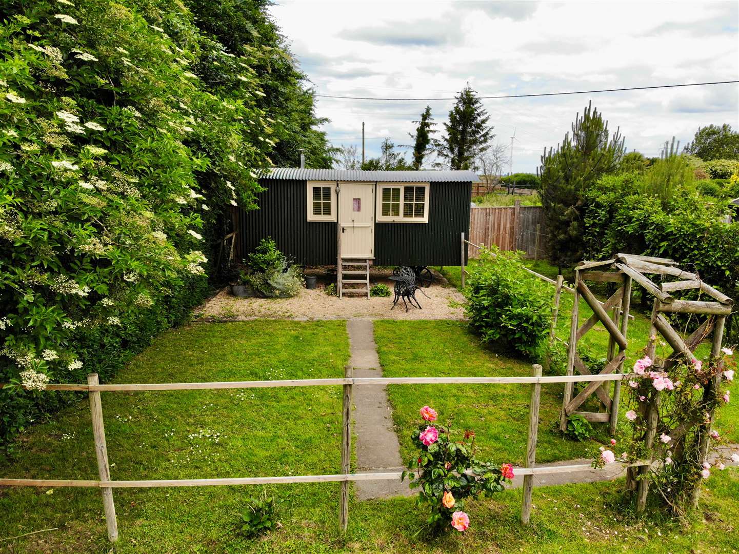 The shepherd huts have their own little garden to sit out in. (57395768)