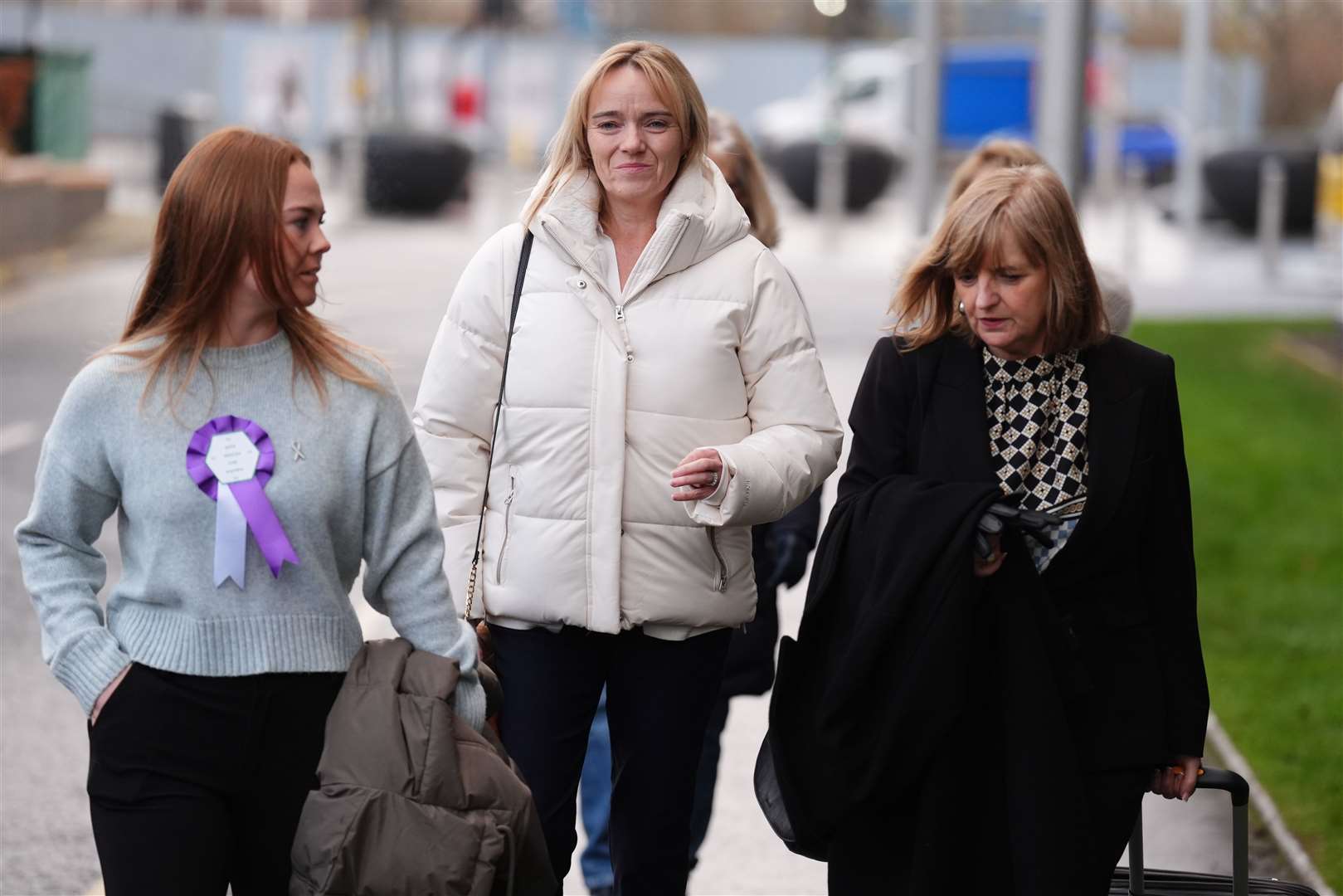 Sandie Peggie (centre), ‘continues to draw strength’ from the support she receives from around the world, her solicitor said (Andrew Milligan/PA)