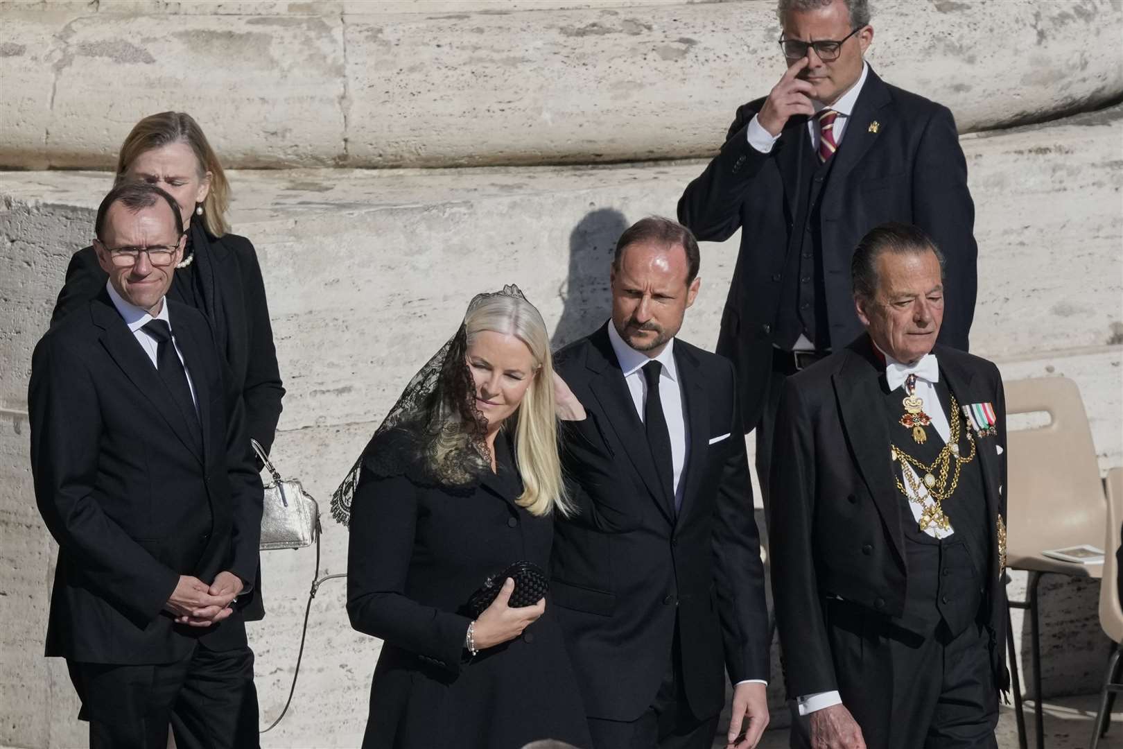 Norway’s Crown Prince Haakon (centre) and Crown Princess Mette-Marit at the funeral (Gregorio Borgia/AP)