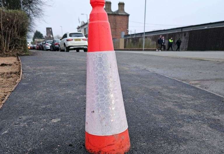 Residents baffled after cone left embedded in tarmac following sinkhole repairs