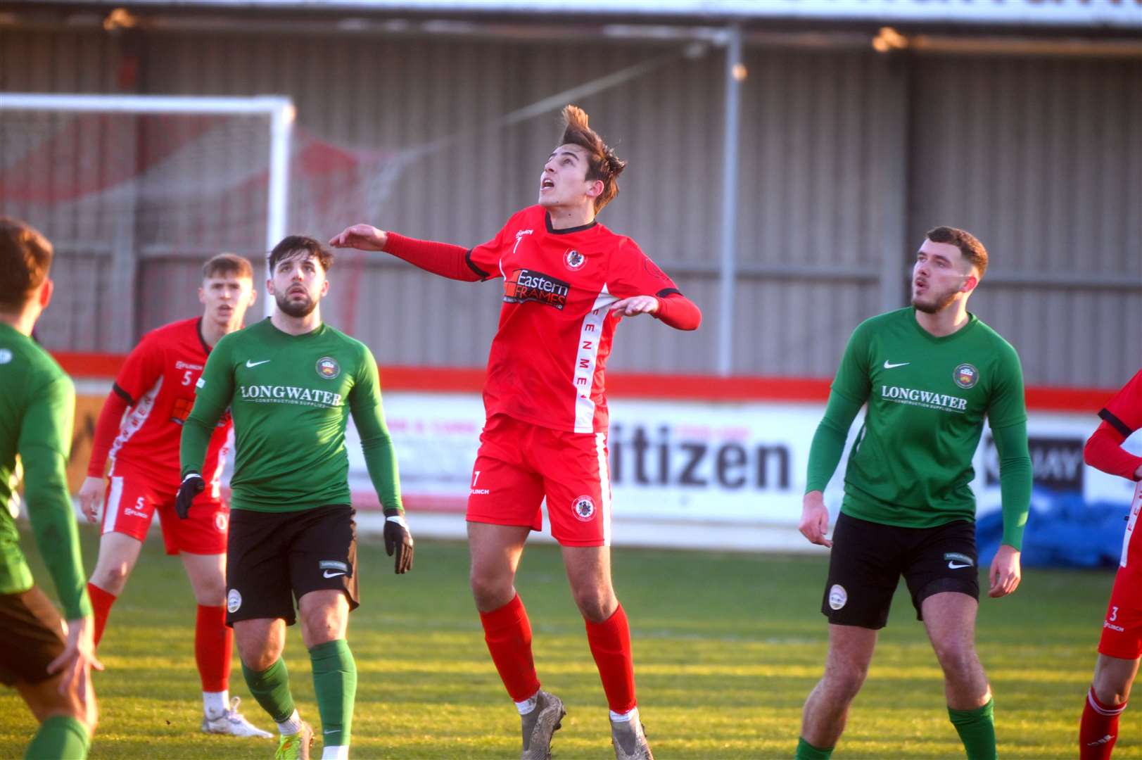 Arun Jones goes up for a header