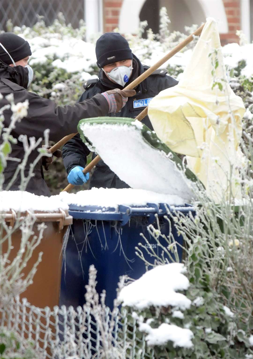 General view of police carrying out searches in Magazine Lane just after Una Crown was murdered at her home in Magazine Lane in Wisbech in January 2013.