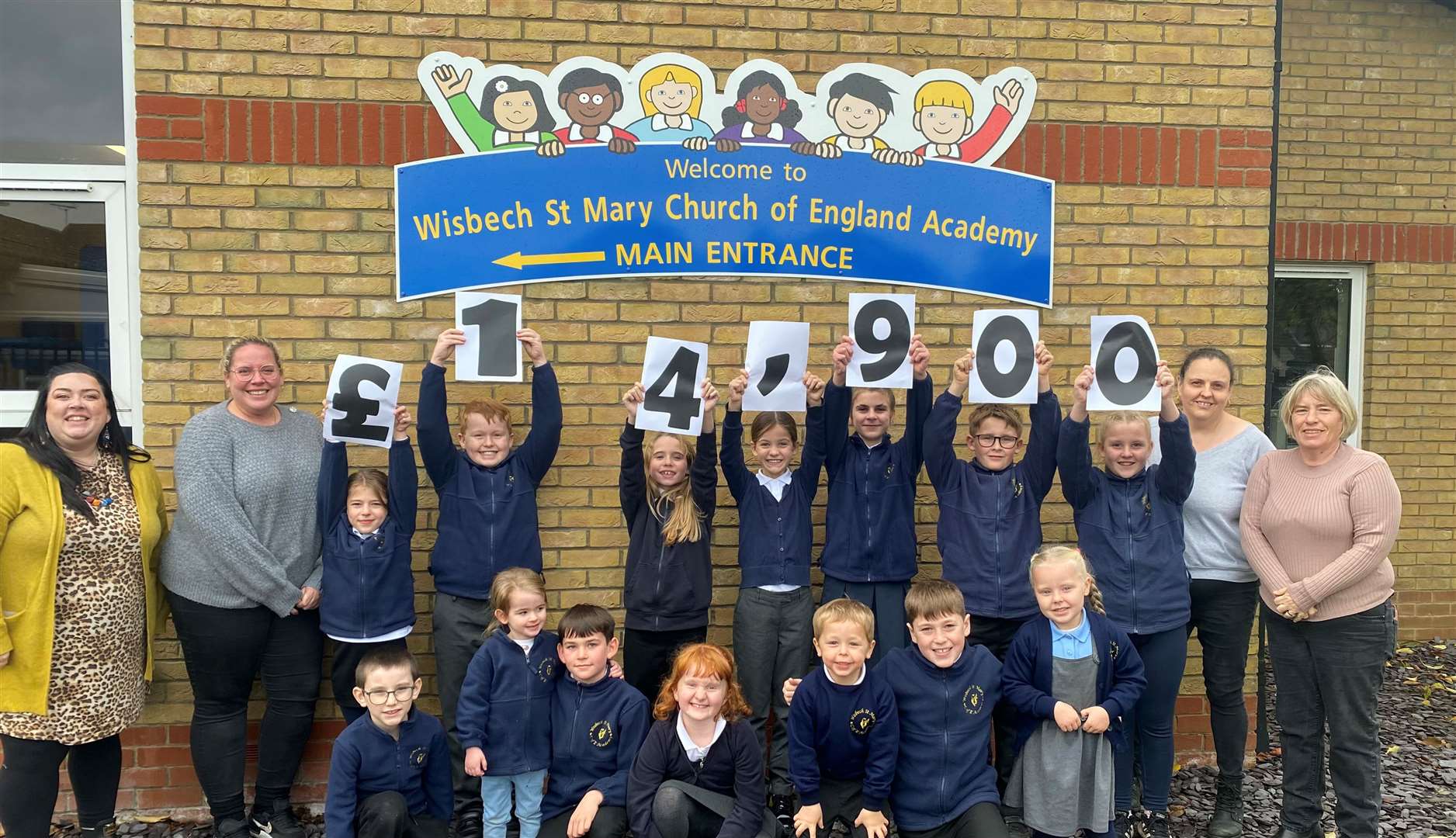 Wisbech St Mary Church Of England Academy’s annual firework display was a 'sky-high' success - pictured is headteacher Miss Jaynie Lynch with pupils and members of the PTFA. Picture: Wisbech St Mary Academy
