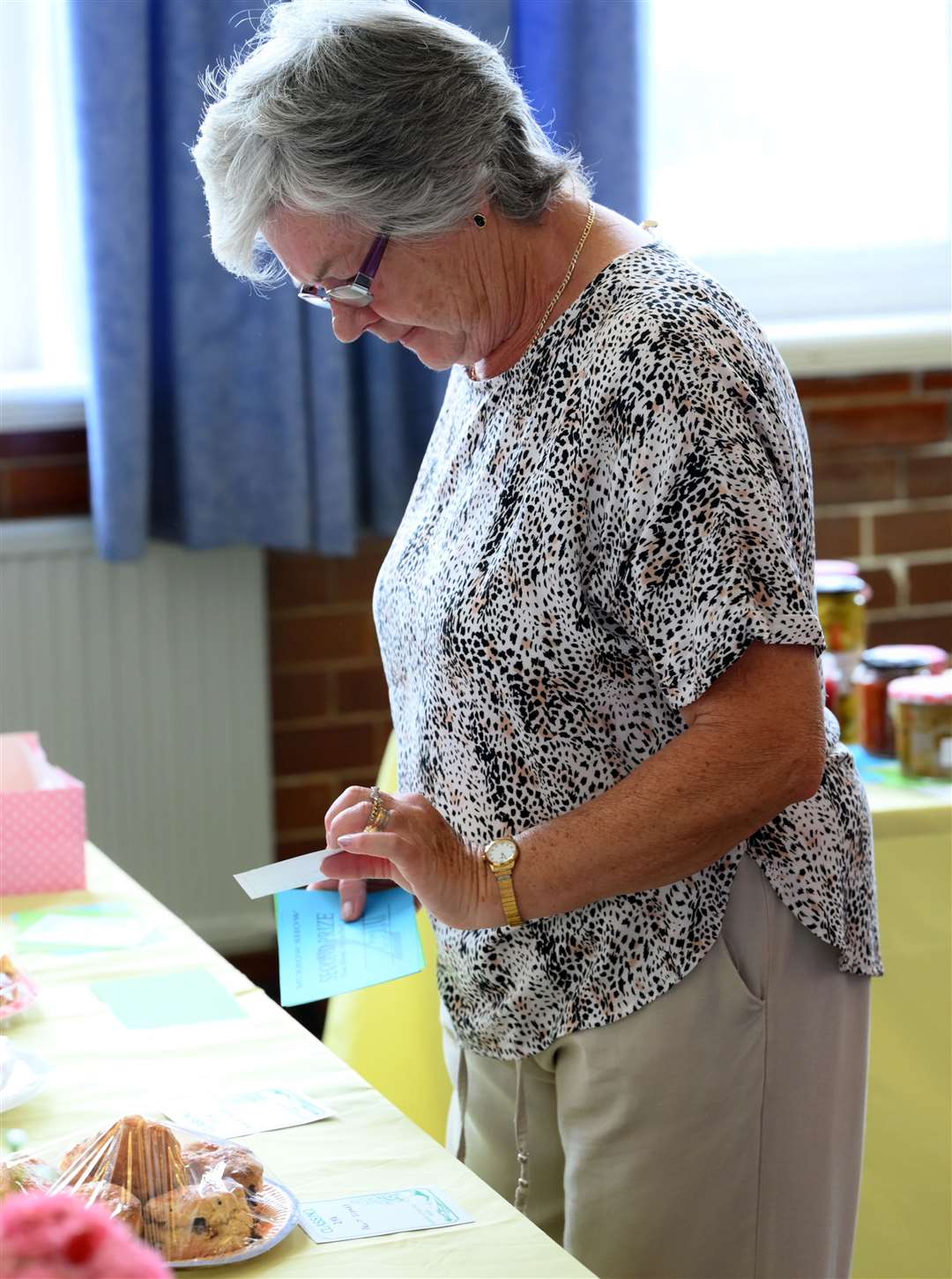 Yvonne Reader helping to put the exhibits on show.
