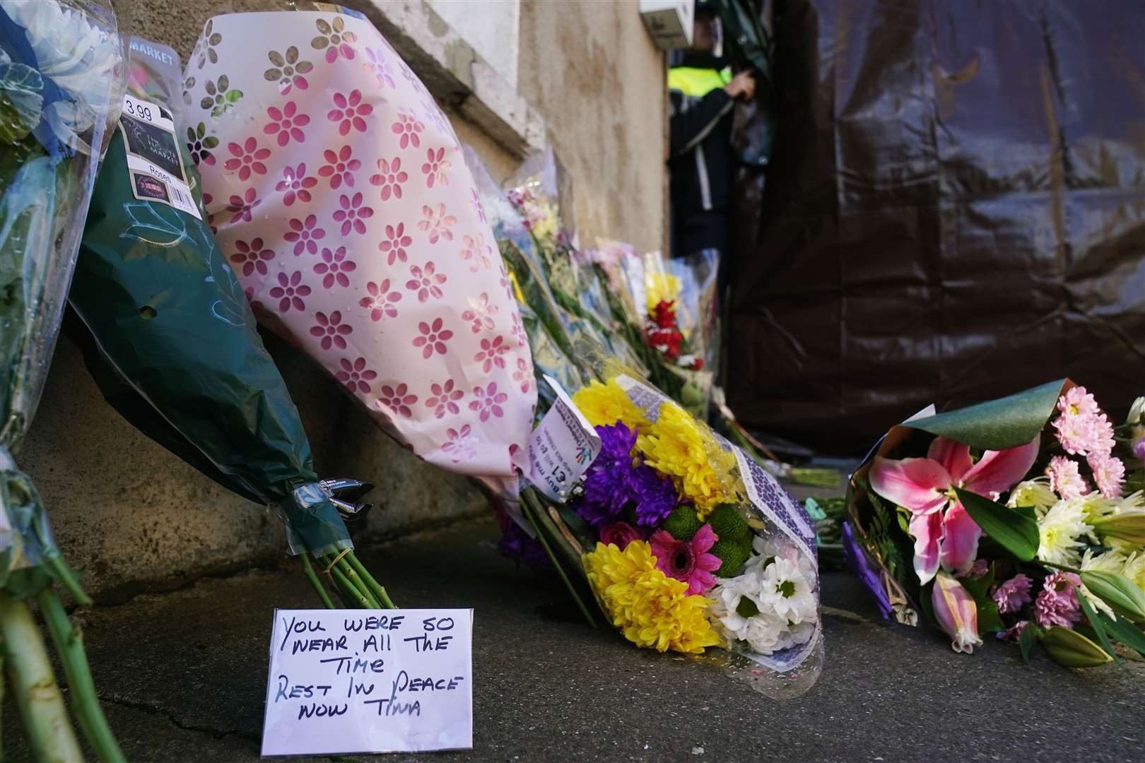 Flowers and messages left near the scene in Youghal, Co Cork, where Tina Satchwell’s body was found (Brian Lawless/PA)