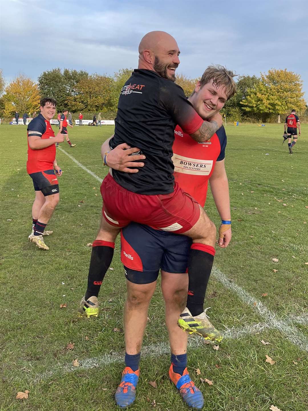 Wisbech front row Luke Green and Renegades fly half Daniel Stockbridge' who had a 'disagreement during the match' showing mutual respect at the full time whistle