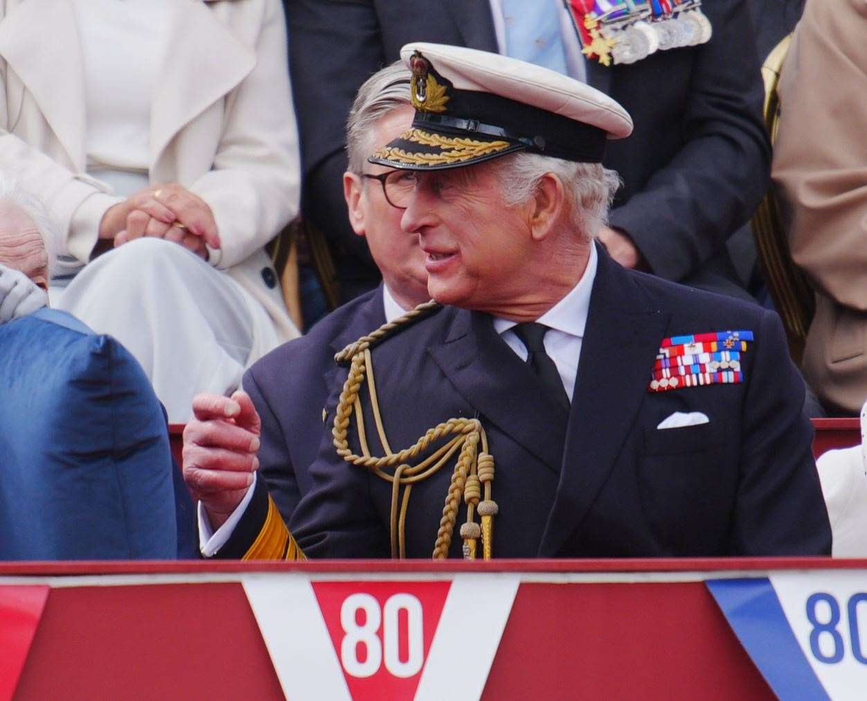 The King watching the military procession (Ben Birchall/PA)