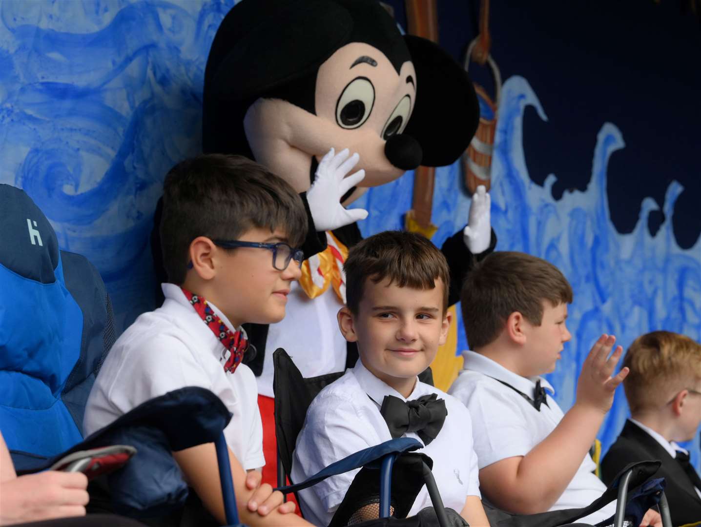 The kids were dressed up in shirts and bow ties
