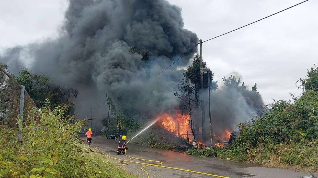 The fire in Oldfield Lane, Wisbech, led to the discovery of cannabis plants being grown in lorry trailers at a scrap yard.