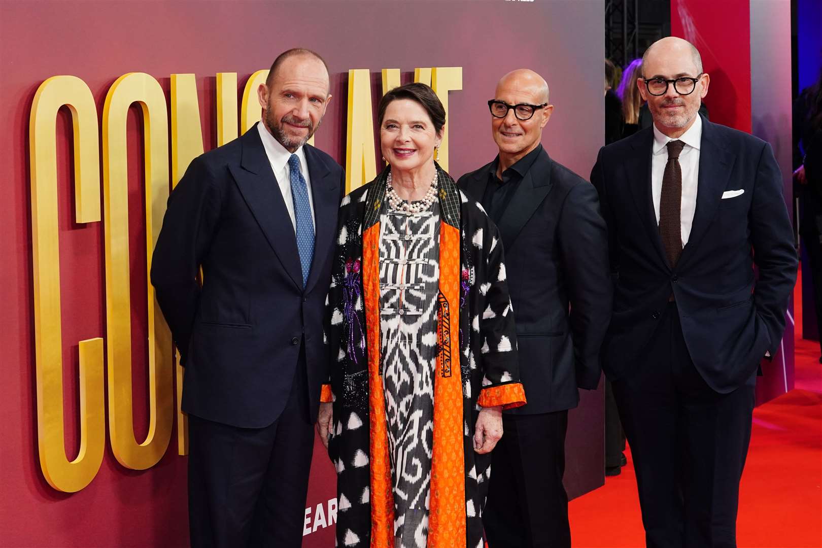 The starts of Conclave, Ralph Fiennes, Isabella Rossellini and Stanley Tucci, and director Edward Berger (Ian West/PA)