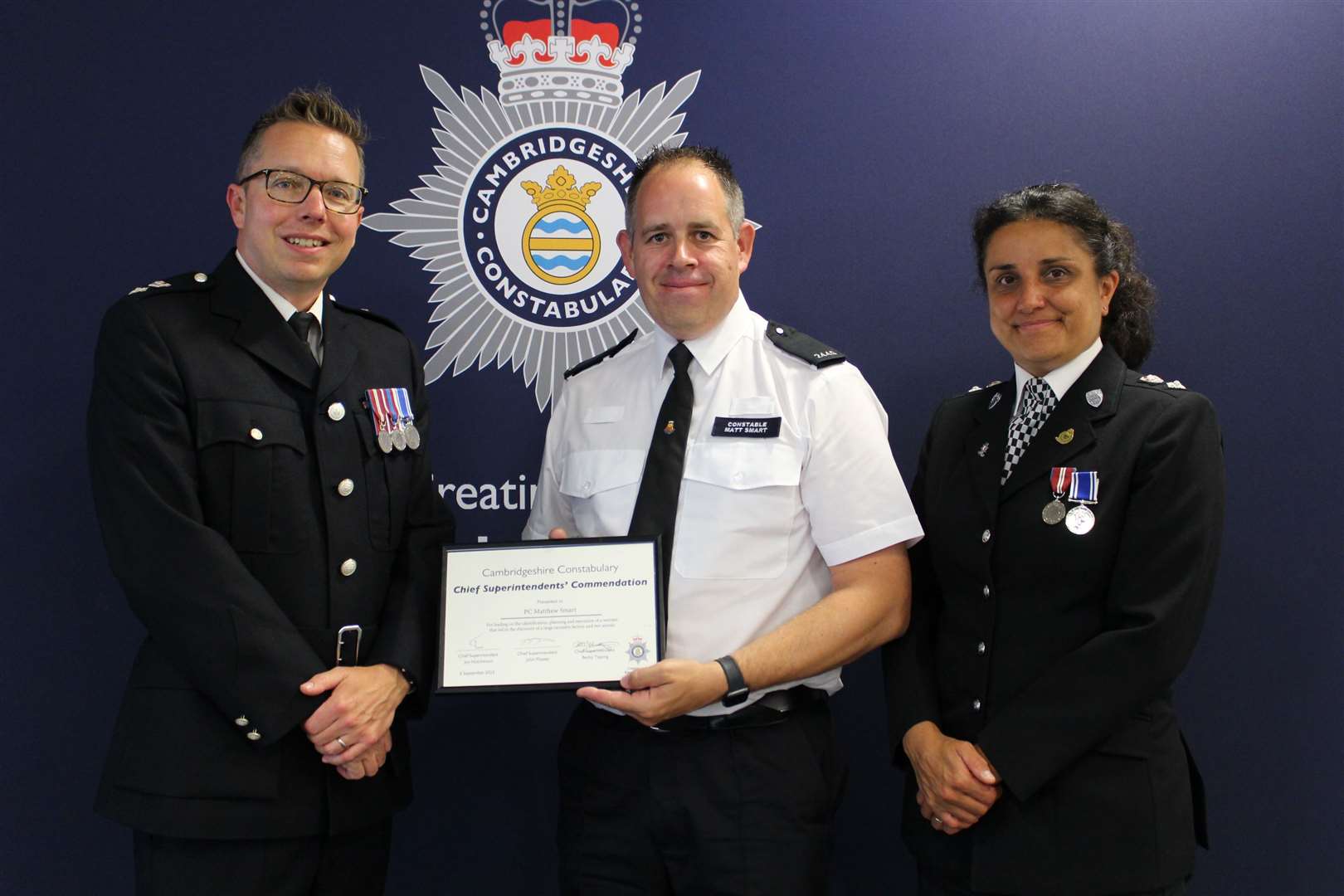 PC Matt Smart receiving his award.