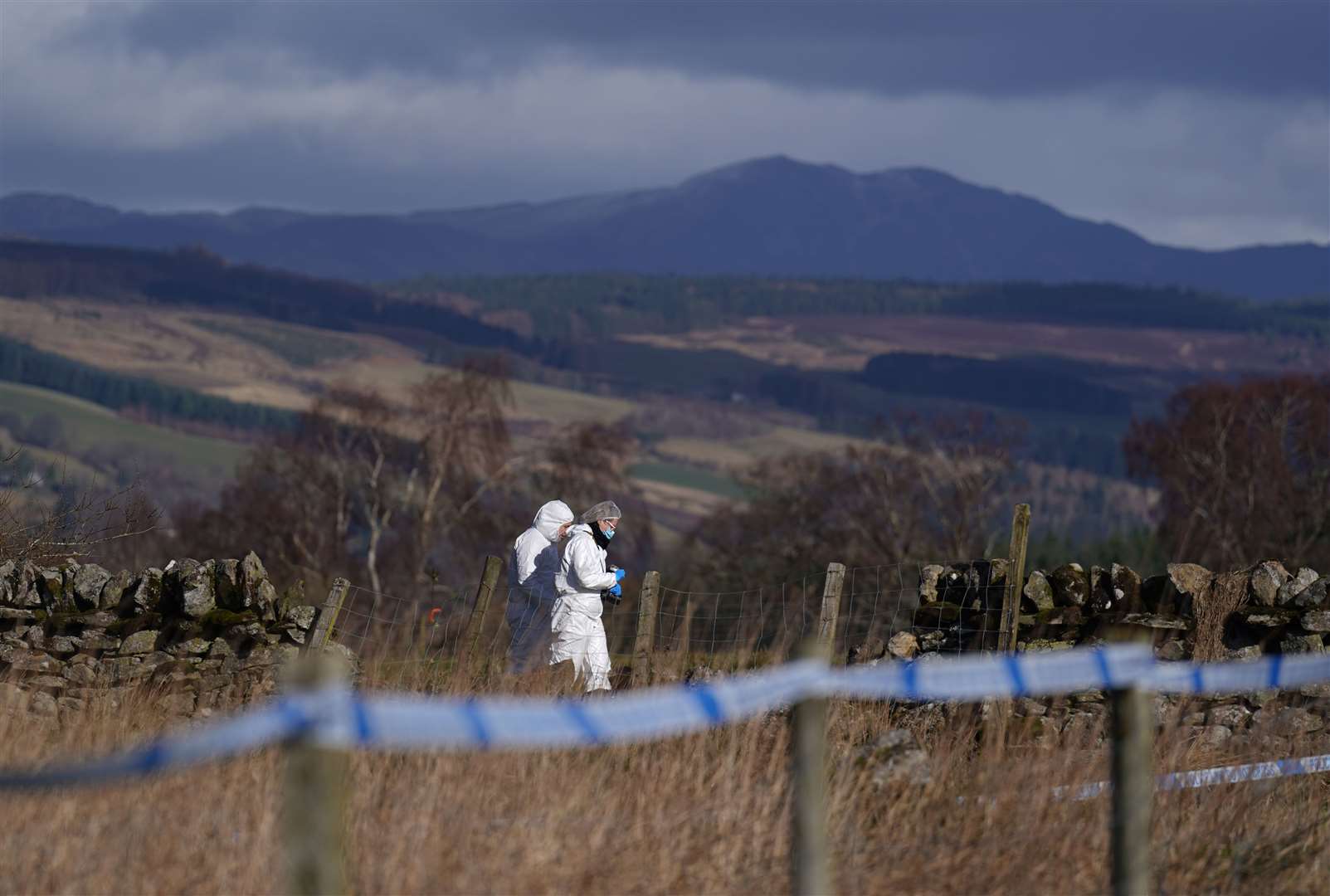 Police at the scene in the Pitilie area on the outskirts of Aberfeldy, Perthshire, where the body of Brian Low was found (Andrew Milligan/PA)