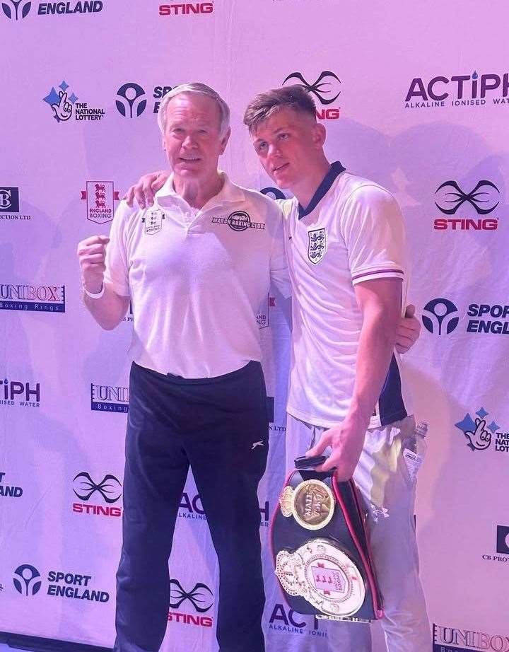 Harley Burrows with his coach Dave Cole following his National title success