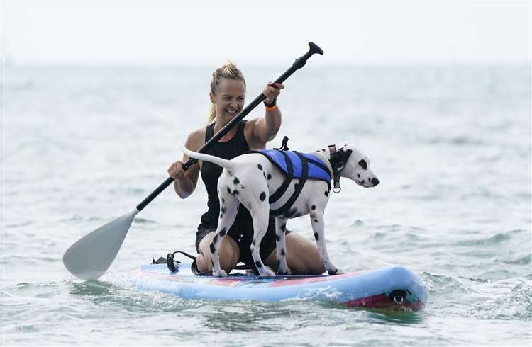 Marina White and her pet Coco took part in the Dog Masters 2022 UK Dog Surfing Championships at Branksome Dene Chine beach in Poole, Dorset (Andrew Matthews/PA) (61607484)