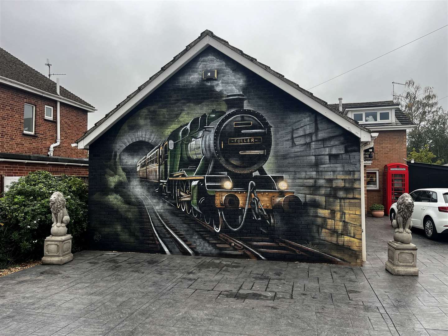 The Fullers wanted to make their garage wall less 'boring' and enlisted artist Nathan 'Nyces' Murdoch to create this mural.