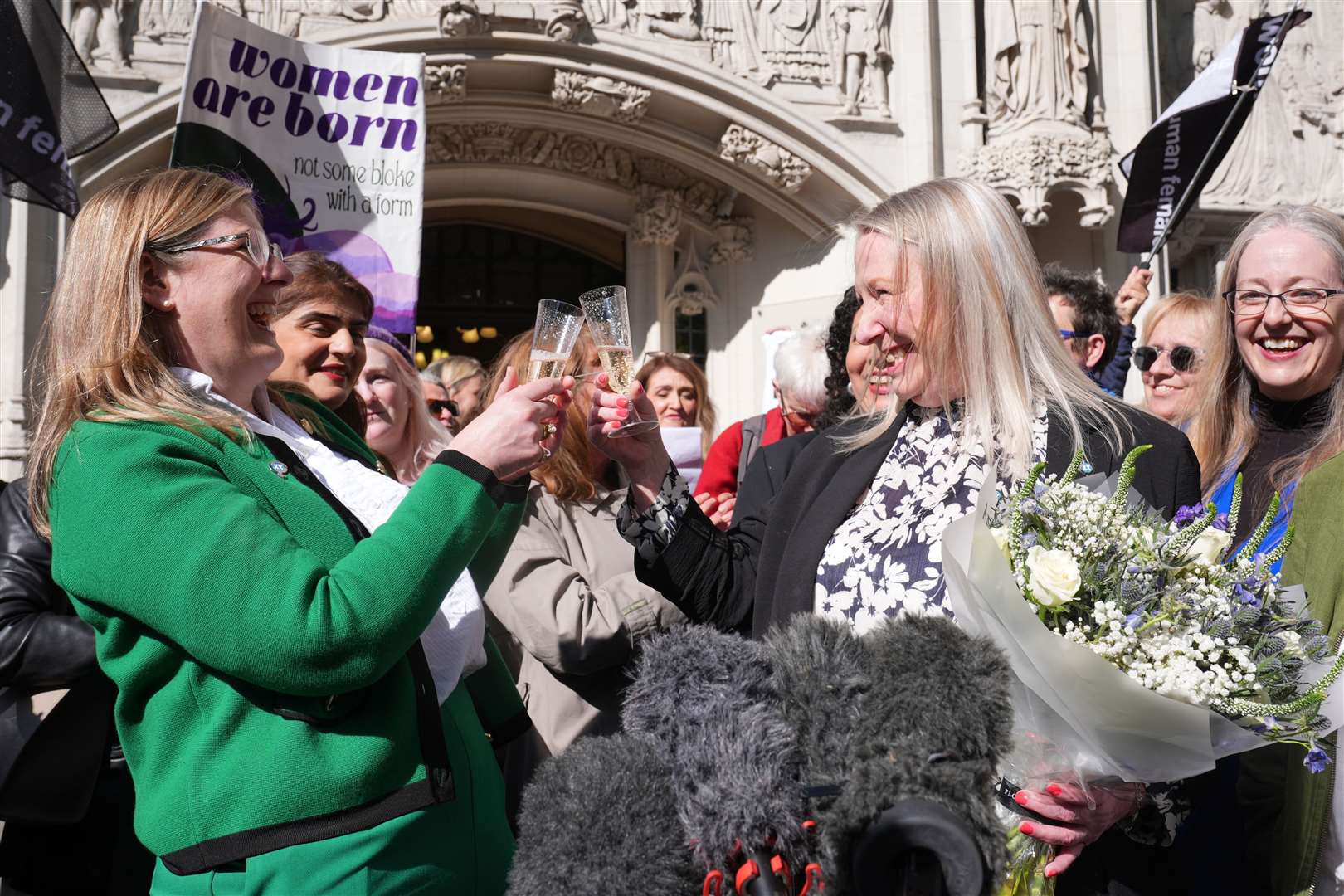 Campaigners celebrated the ruling outside the Supreme Court verdict (Lucy North/PA)