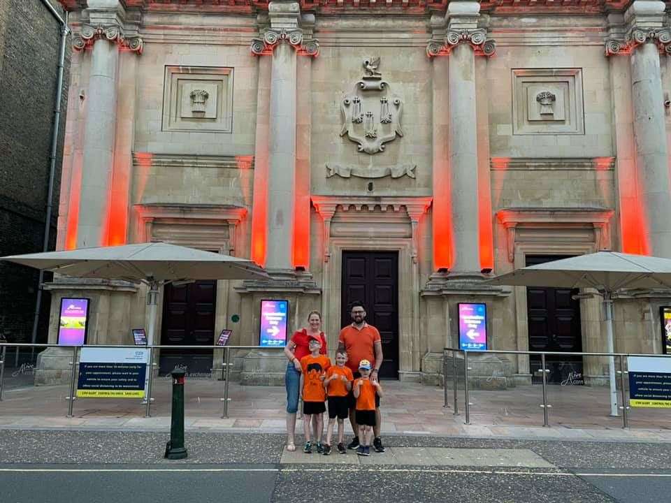 The Dodkin family did a tour of the area to look at buildings that had gone orange on Wednesday to mark National Battens Disease Day, including King's Lynn Corn Exchange.