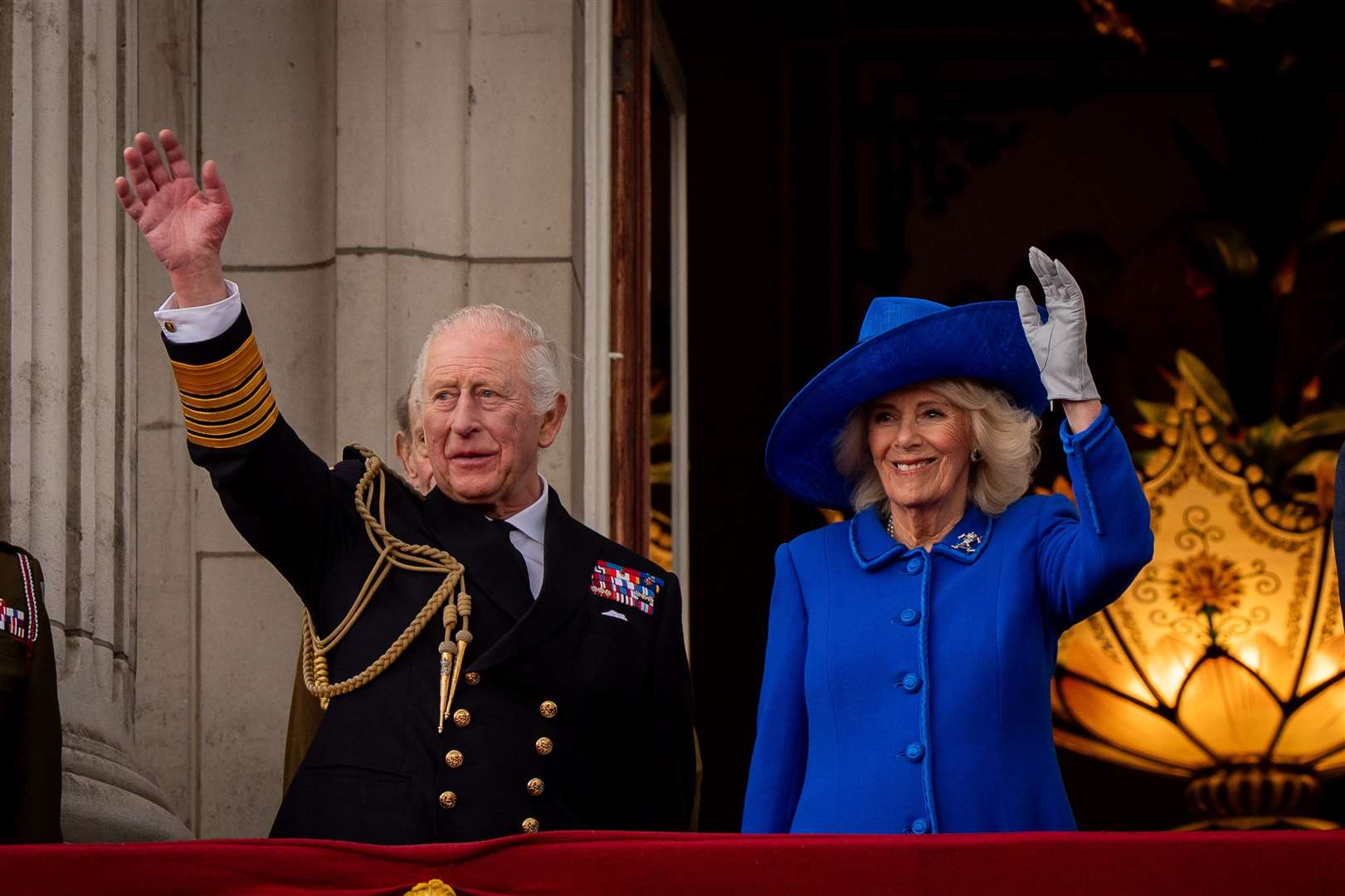 Charles and Camilla on the balcony of Buckingham Palace (Aaron Chown/PA)