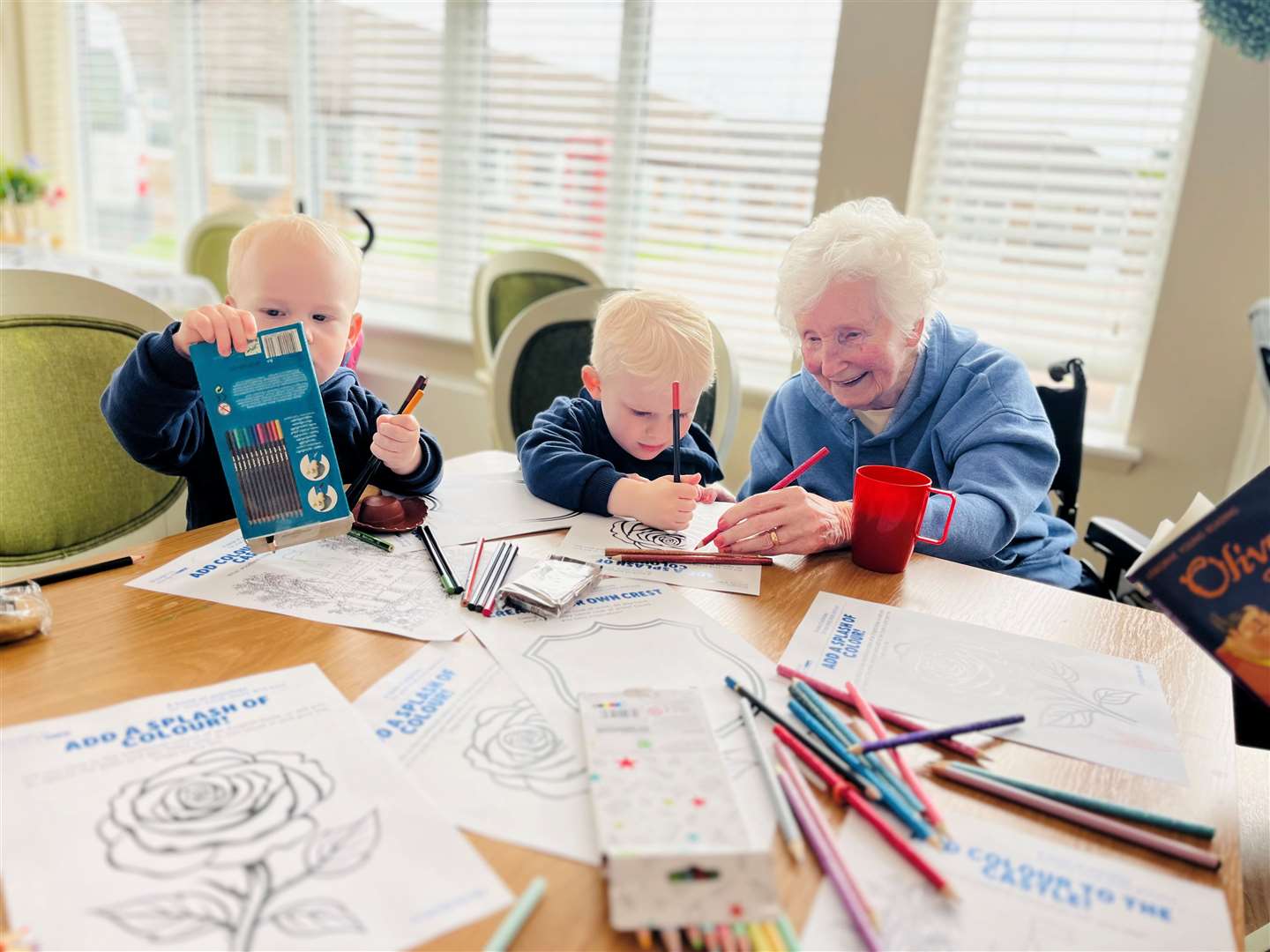 Resident, Jean with the children enjoying St George's day themed activities