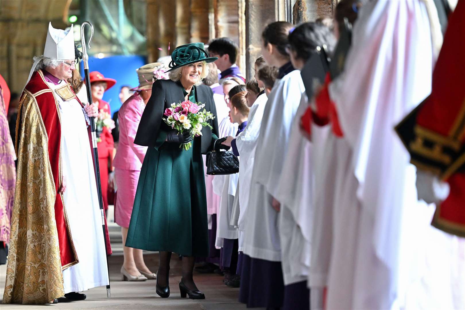 Camilla carries traditional nosegays as she meets choristers at Durham Cathedral (Anthony Devlin/PA)