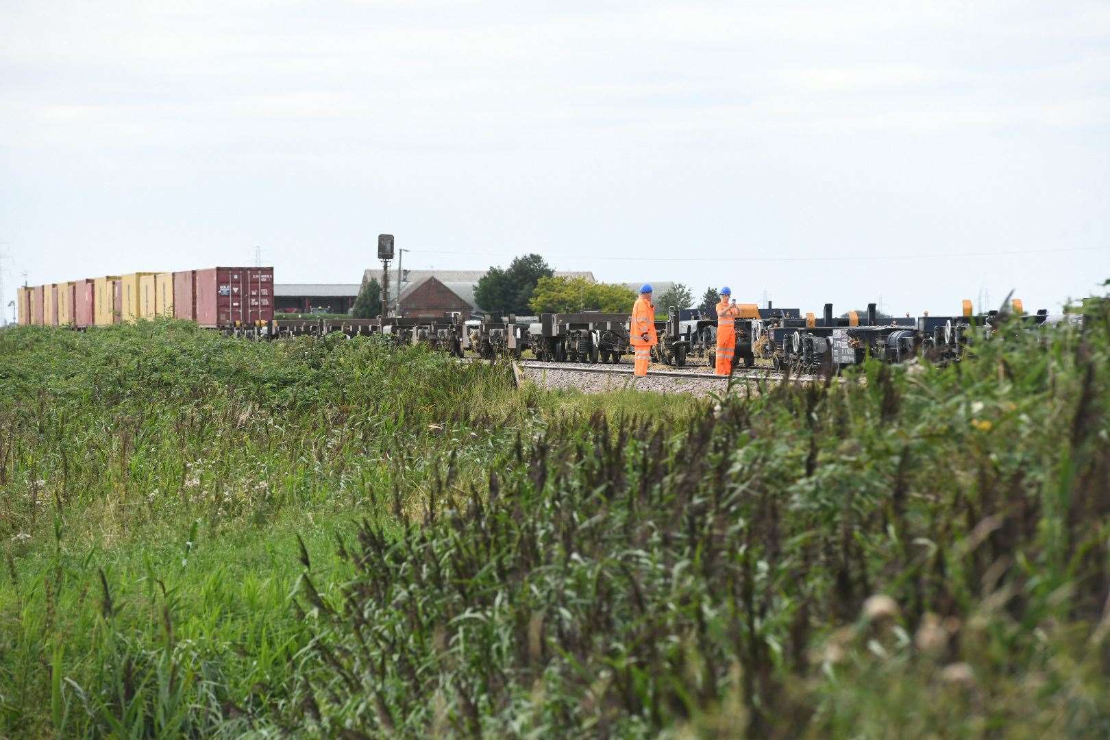 Network Rail staff work to clear the track at March on the day of the crash