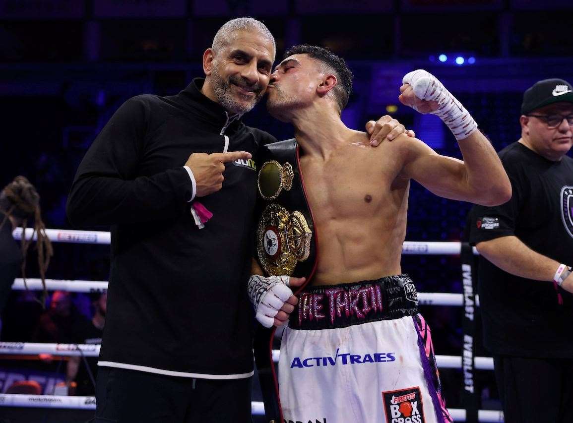 Jordan Gill celebrates his WBA International Super Featherweight Title win with dad Paul. Picture: Mark Robinson (Matchroom Boxing)