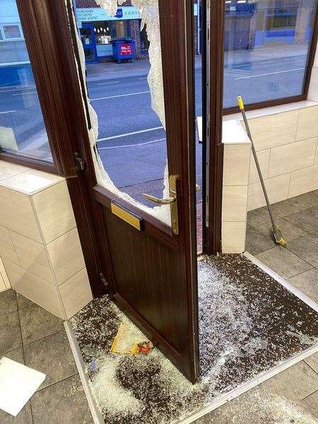 The damage caused to the Jolly Fryer's door by the burglars.