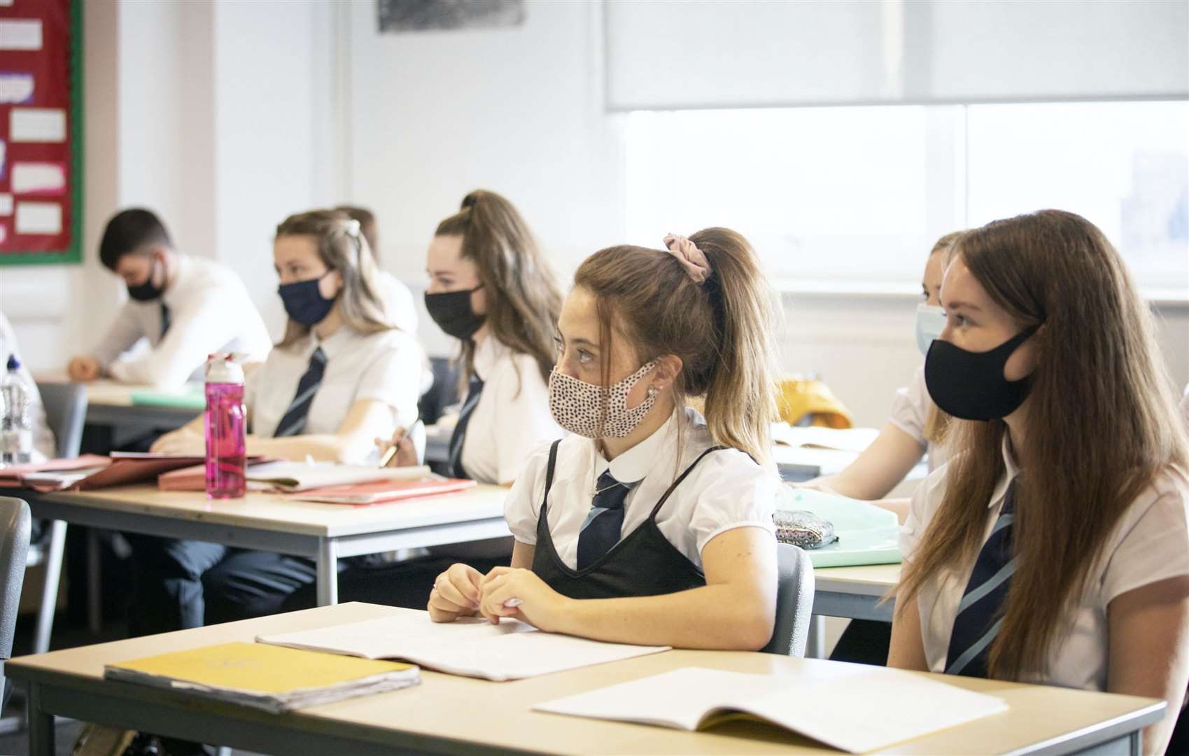 Children can continue to attend class despite a positive test in their household