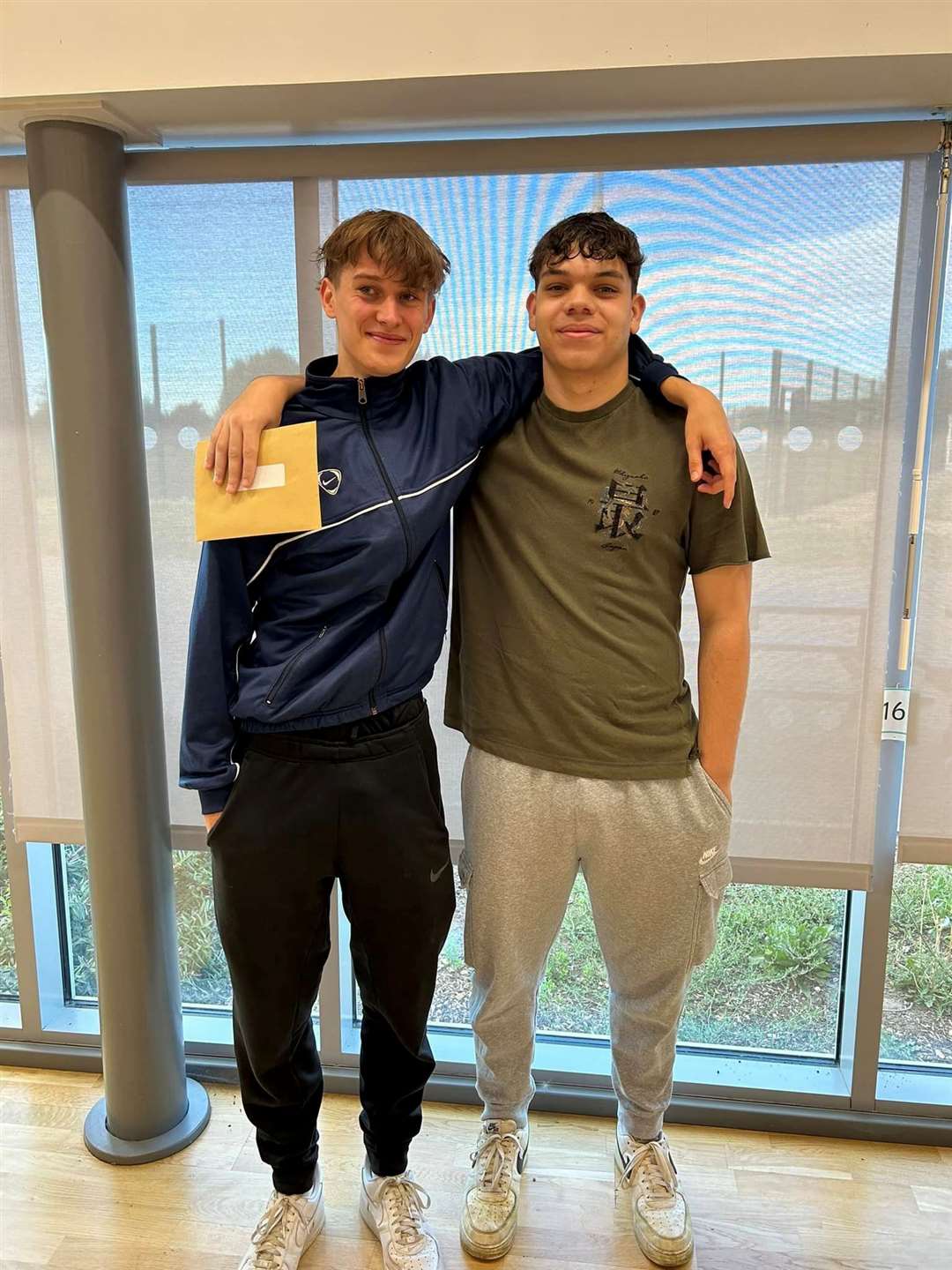 Two Cromwell students with their results.