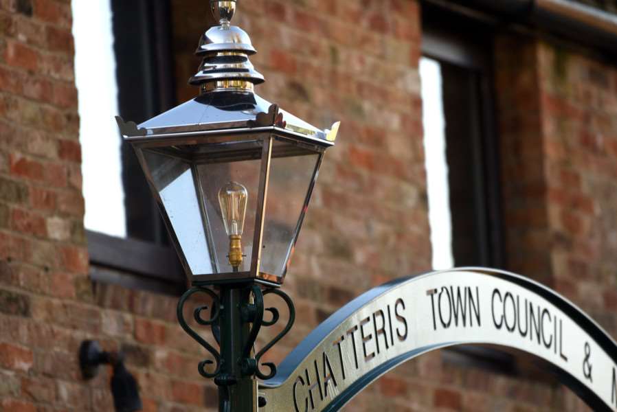 Cllr Julie Smith,Chatteris Mayor Bill Haggata and Chris Howes with newly restored gas lamps outside Chatteris museum 'The newly restored gas lamps outside Chatteris museum