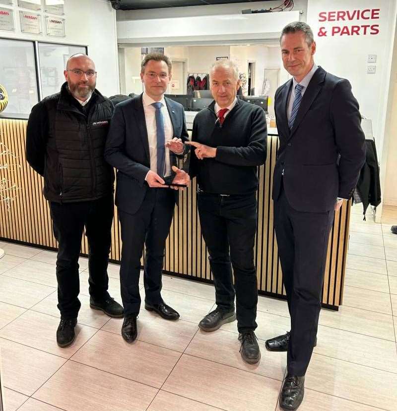 Martin Holmes, second right, Dealer Principal at JS Holmes, receives the company’s award from Nissan aftersales director Nicolas Belaud. Also pictured are JS Holmes director Alex Holmes, left; and Geoff Ollier, Nissan’s national aftersales manager.