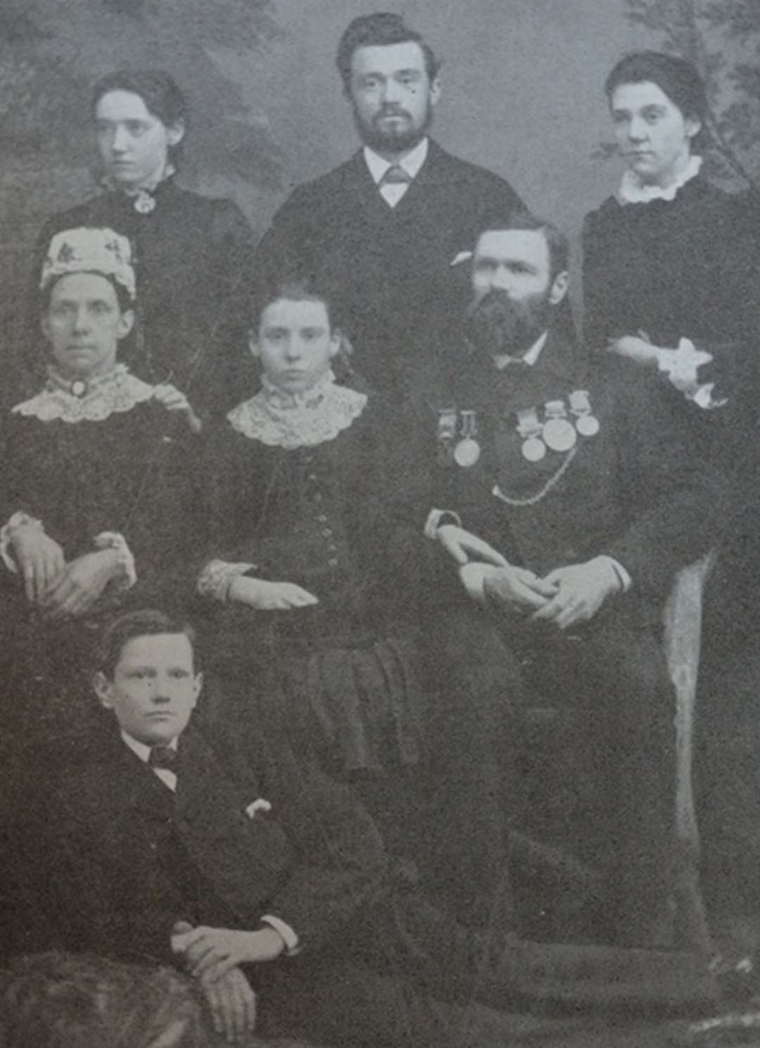 William Tolladay Streader with his family and some of his medals. Picture: John Tibbits