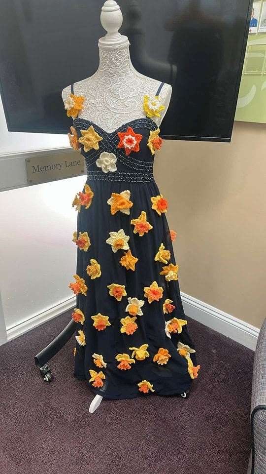 Residents, their families and staff all helped knit dozens of daffodils for the Marie Curie Day of Reflection display