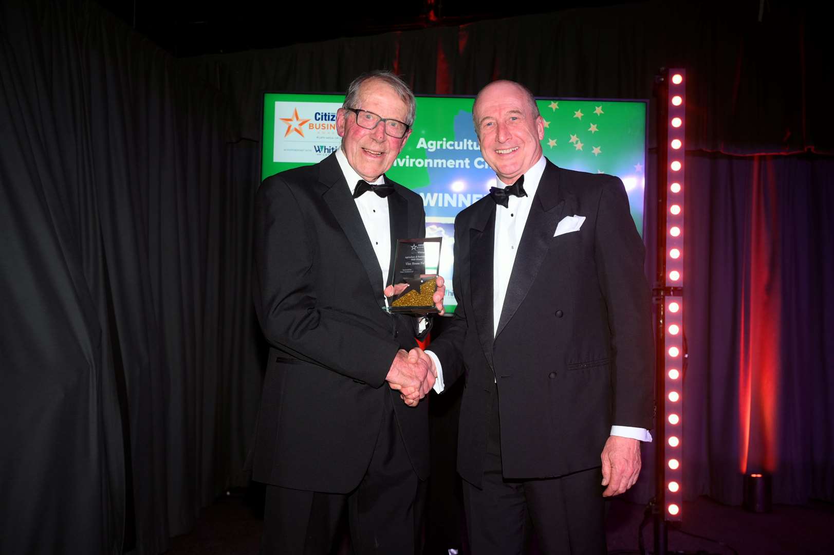 Fenland Citizen Business Awards 2025 Agriculture and Environment Champion winner Nicholas Watts (left) of Vine House Farm received his award from Tony Cheetham of category sponsor Fraser Dawbarns