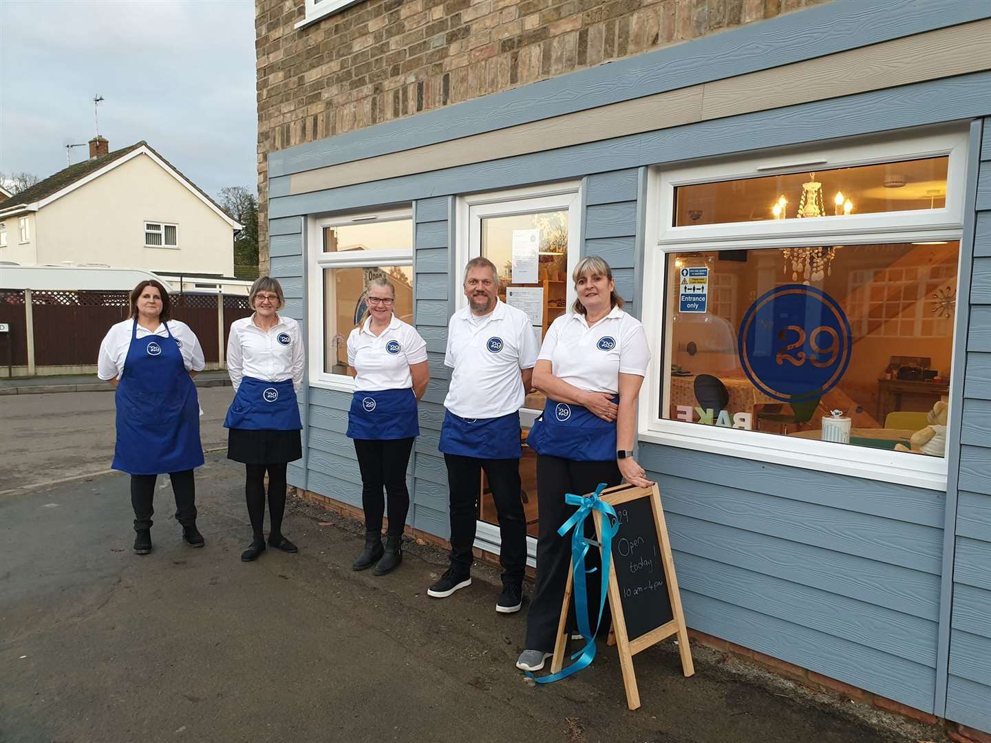 Caroline Barnes pictured far right on the cafe's official opening day - after three years she has had to call it a day.