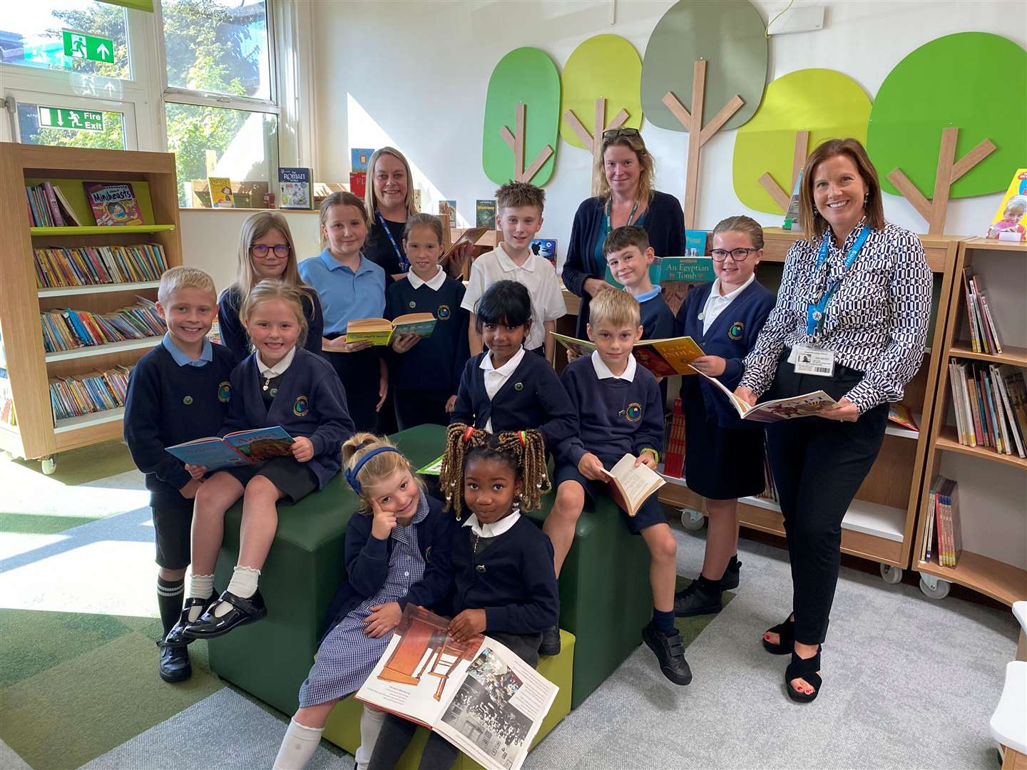 Staff and pupils from Kingsfield Primary School in their newly revamped library.