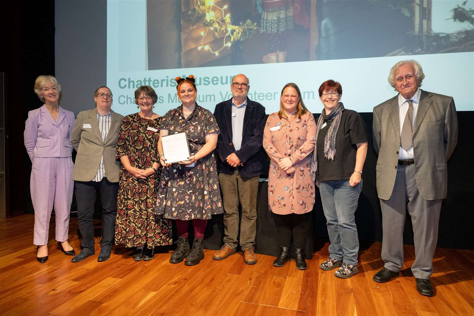 The volunteering team with their award at the ceremony at the British Museum in London
