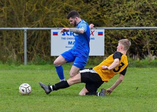 Action from the game between Outwell Swifts (blue) and March Town A (black and amber). Picture: Andrew Lister