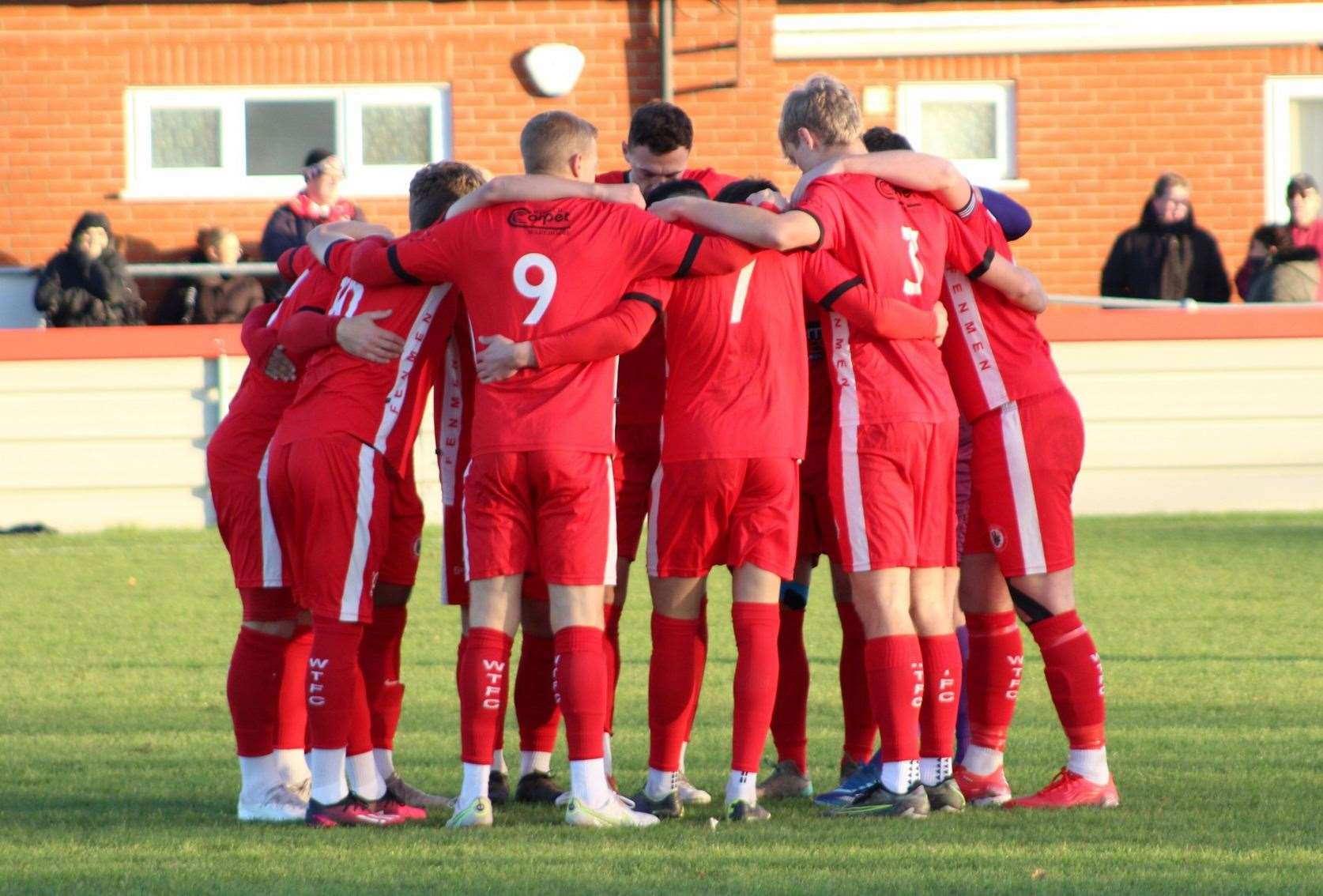 A pre-match huddle for the Wisbech Town squad before their clash with Boston Town. Picture: Erin Larham