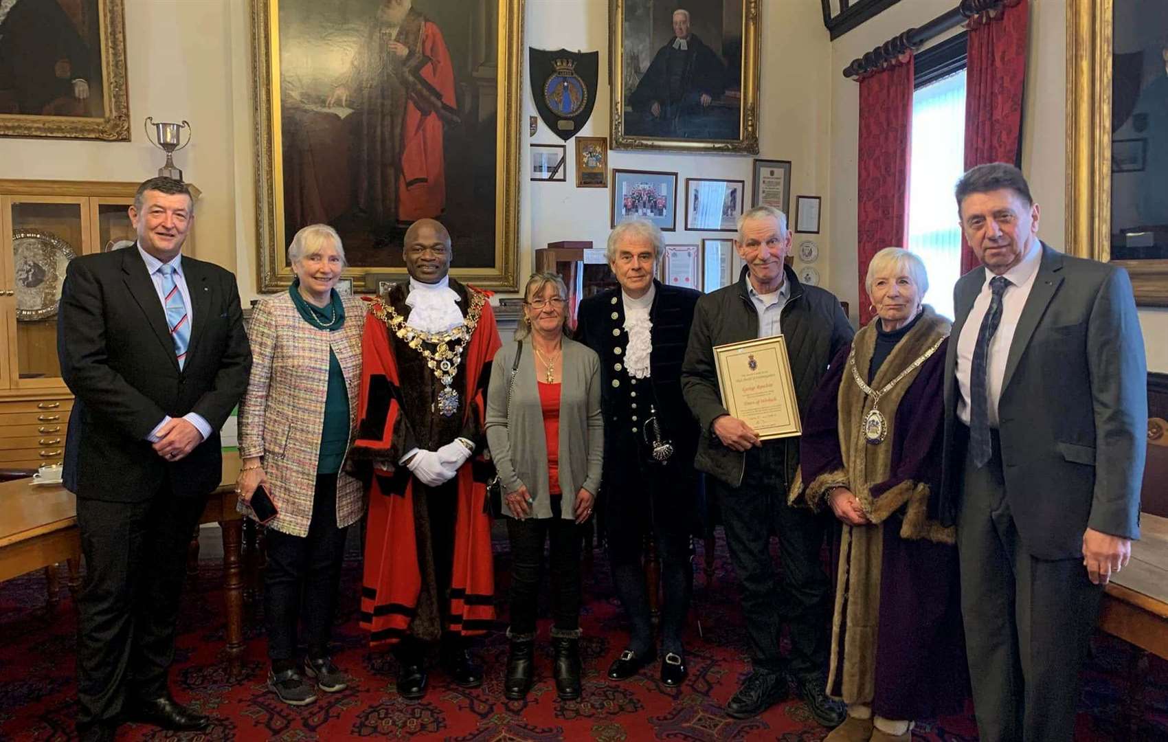 George Rowlett - third from right with his certificate, his wife Diane is pictured between the mayor and the High Sheriff