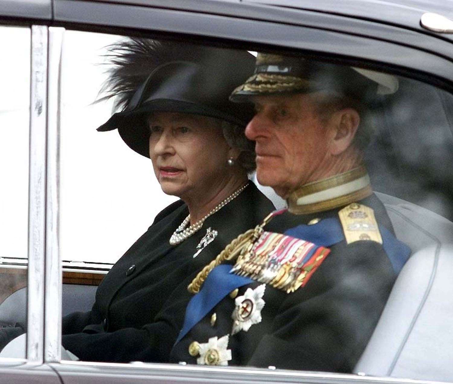 The Queen and Prince Philip, pictured at the Queen Mother's funeral service, will be laid to rest together on Monday night. Picture: PA.
