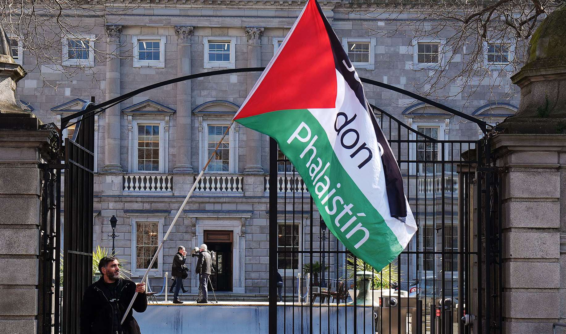 A pro-Palestine demonstrator outside the Dail in Dublin in March (Brian Lawless/PA)