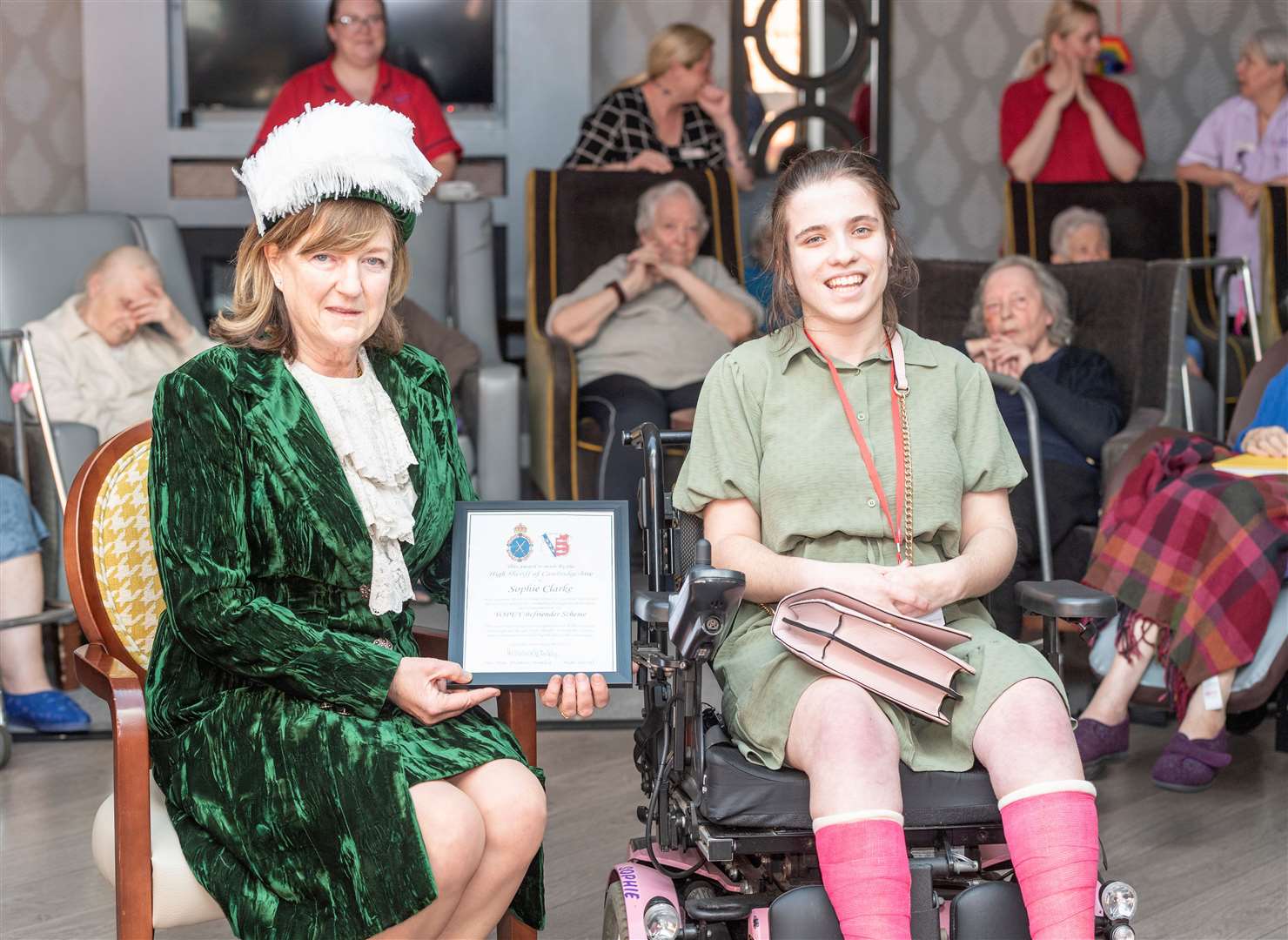 The High Sheriff of Cambridgeshire presents the certificate to Sophie