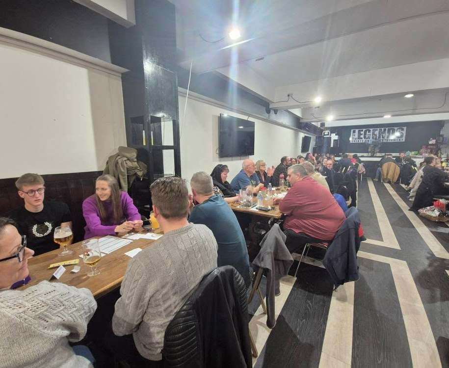The quiz teams put their thinking caps on to find the answers to quizmaster Tommy's questions