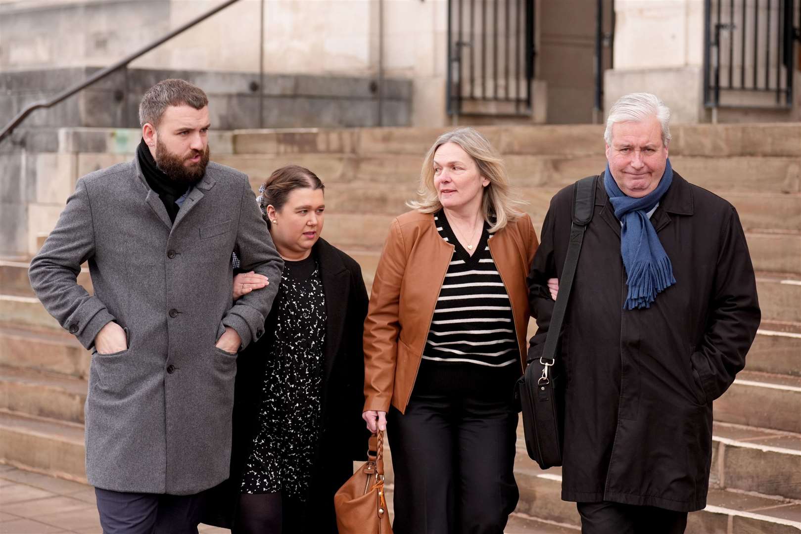 Maddy Cusack’s brother Richard with his partner Emily Baker, and her parents Deborah and David Cusack (Joe Giddens/PA)
