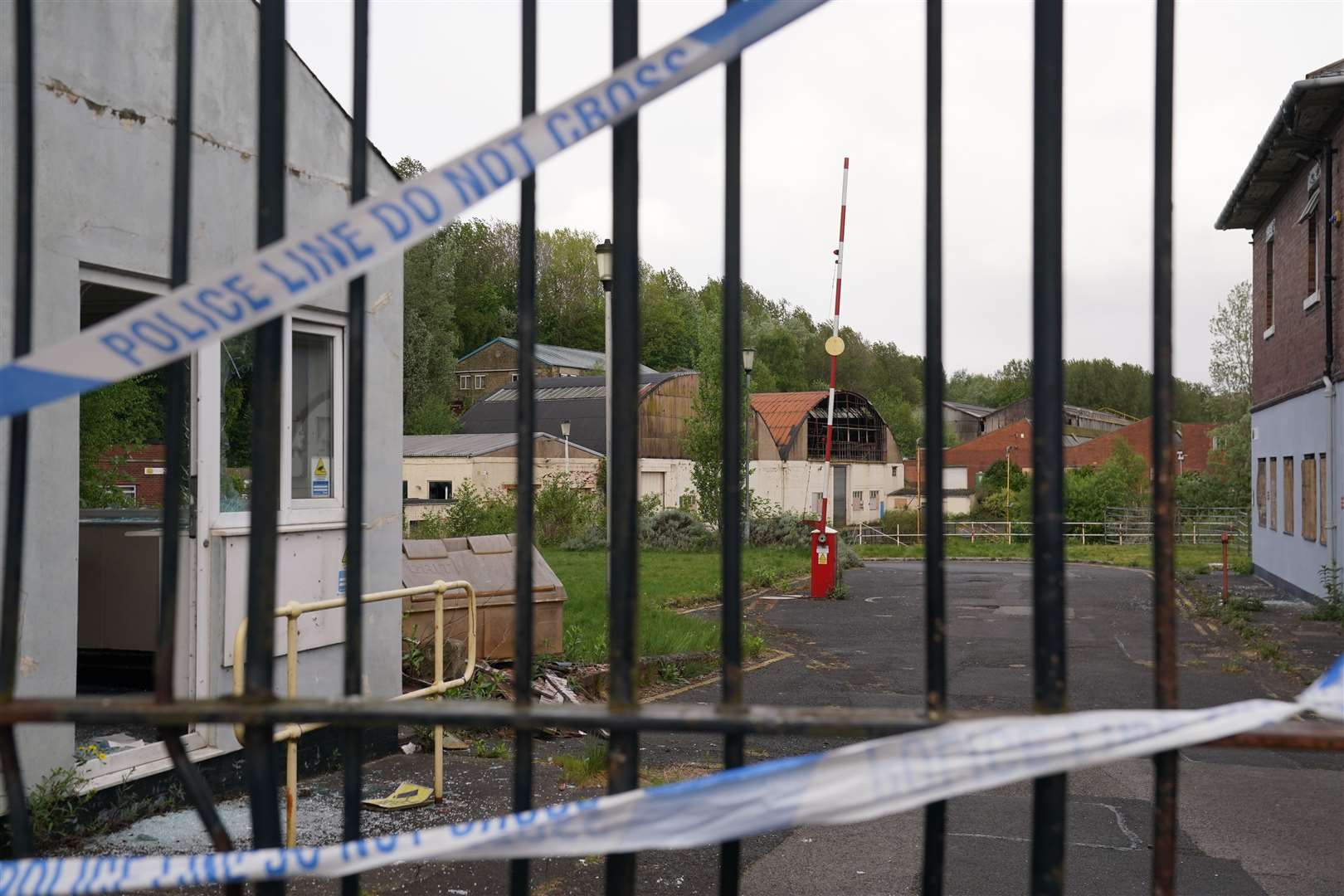 Police tape on the gates of Fairfield Industrial Park (Owen Humphreys/PA)