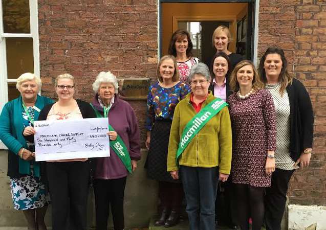 Bakers from Bully Davey present the cheque to members of Wisbech Macmillan Support Group