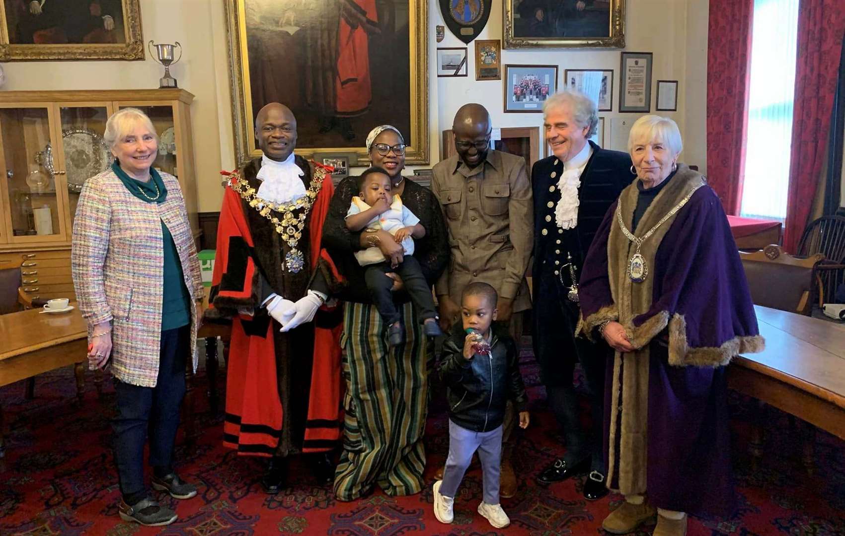 Dr Olutsin Awoyemi with his certificate pictured with his family, the mayor Cllr Sidney Imafidon, the High Sheriff, David Way, and deputy mayor Janet Tanfield
