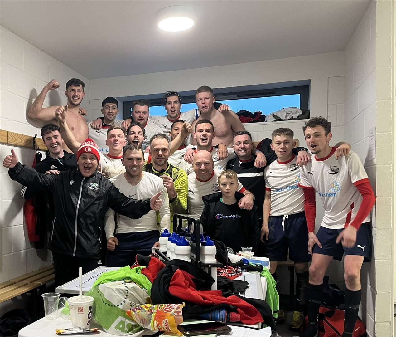 Tydd celebrate their brilliant win at Stilton United