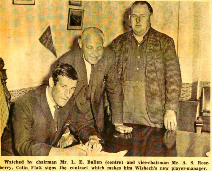 Colin Flatt signs as Wisbech player manager, watched by chairman L.E Bullen and vice-chairman MR A.S Roseberry. (35438529)